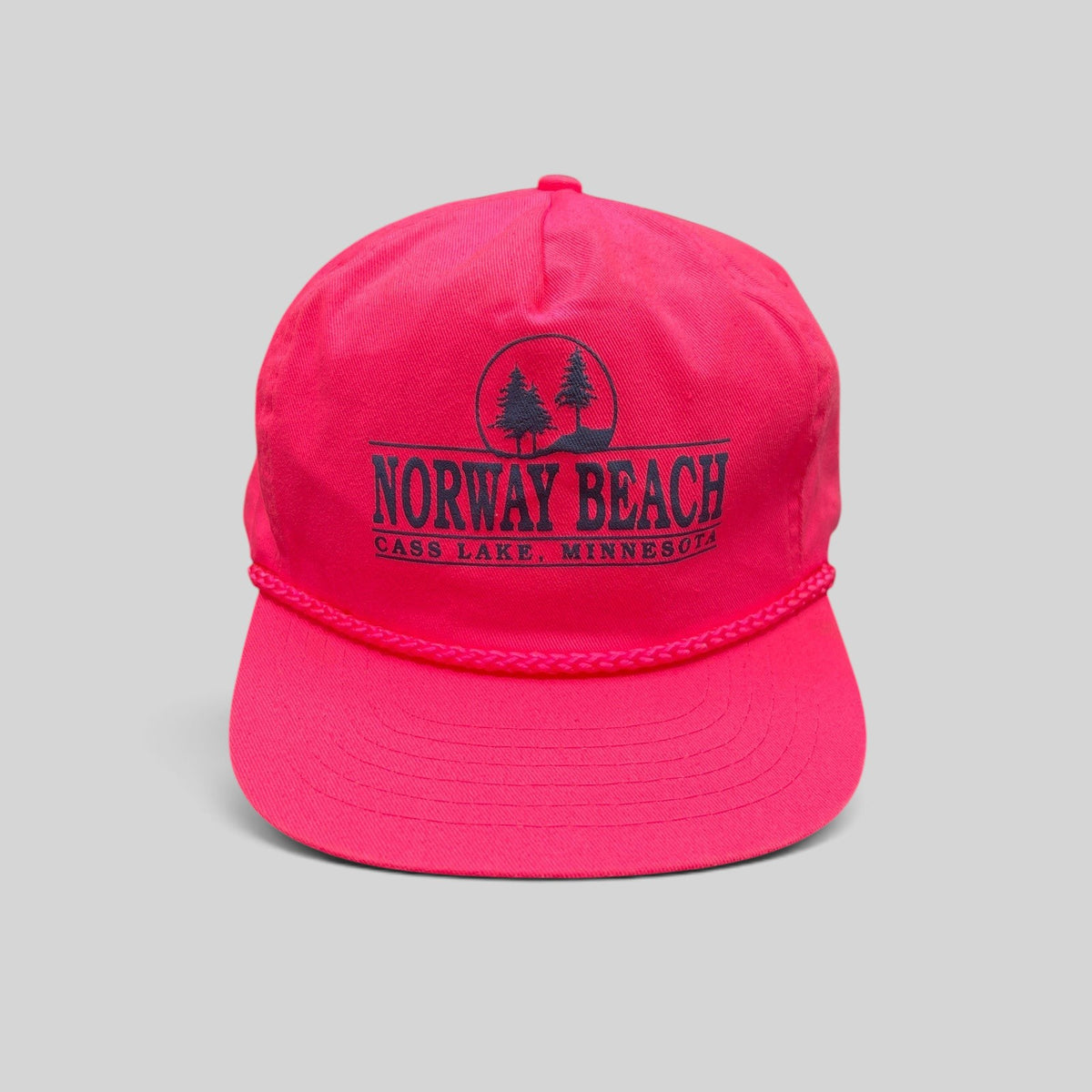 Raree Finds vintage 1980s neon pink snapback hat with navy Norway Beach graphic and decorative front braided rope.