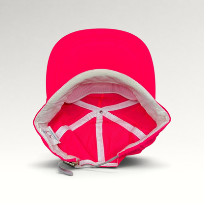 Raree Finds vintage 80s neon pink nylon ski hat with white interior lining and adjustable metal clasp strap