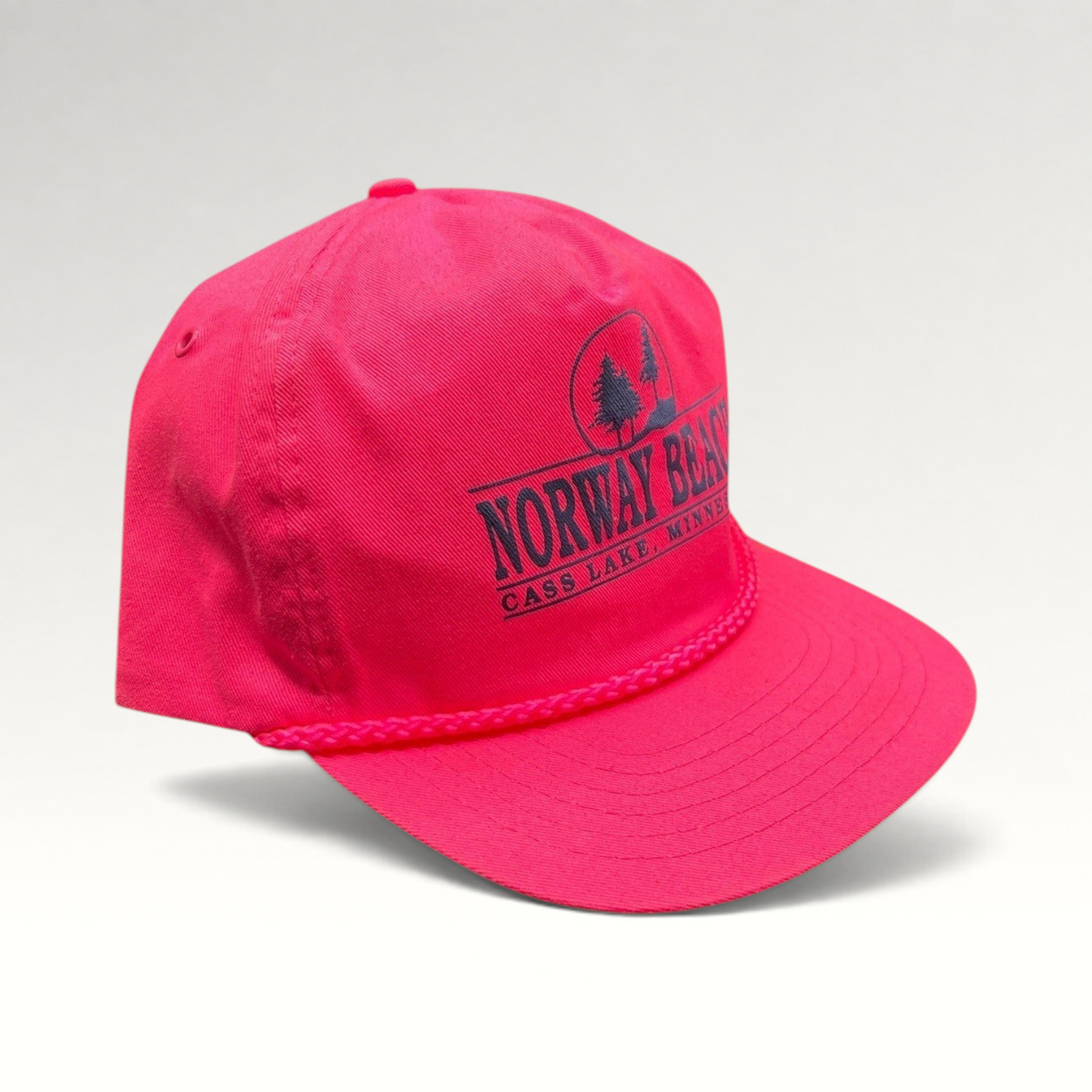 Raree Finds vintage 1980s neon pink snapback hat with navy Norway Beach graphic and decorative front rope detail.