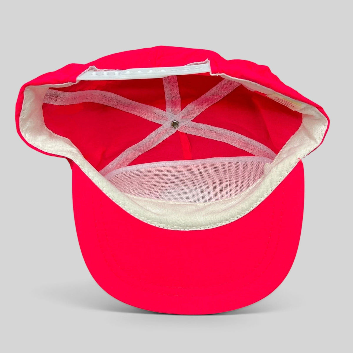 Raree Finds vintage 1993 Aspen Air Show neon red snapback hat, interior view showing white lining and adjustable strap.