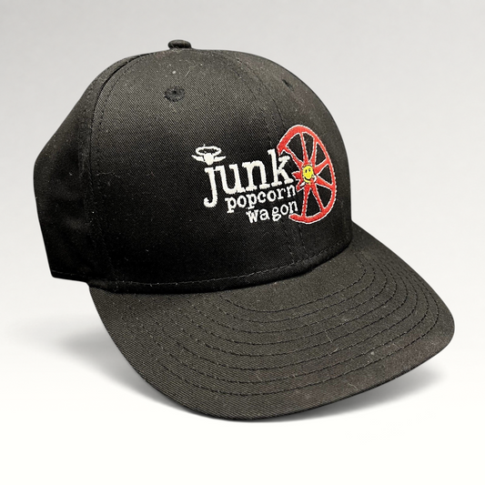 Raree Finds vintage black New Era snapback hat with embroidered Junk Popcorn Wagon Aspen logo and red wheel graphic.