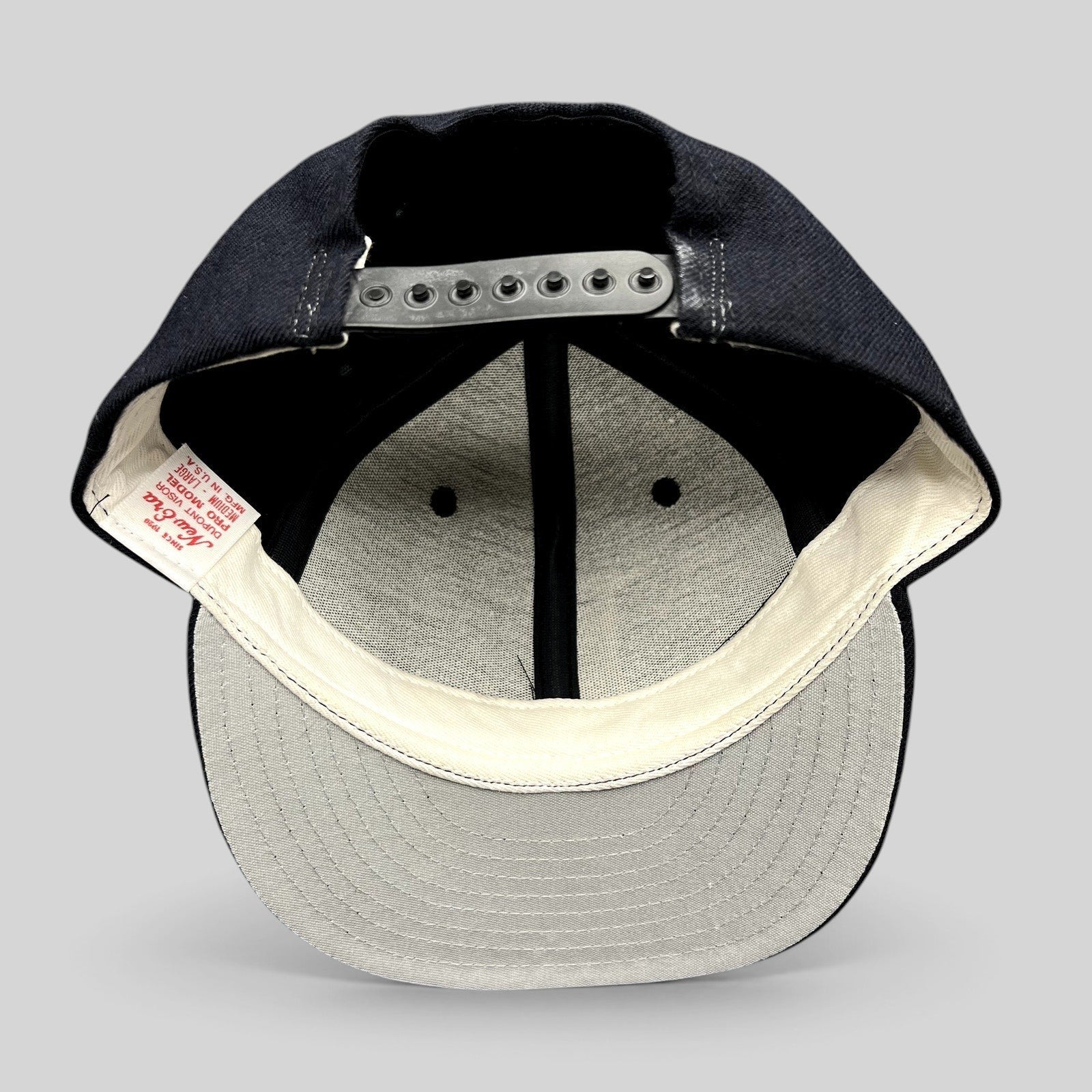 Raree Finds vintage New Era USA made snapback hat interior showing Dupont visor construction and branding label
