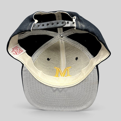Raree Finds vintage New Era Marlton snapback hat interior view showing the structured crown and plastic snap closure.