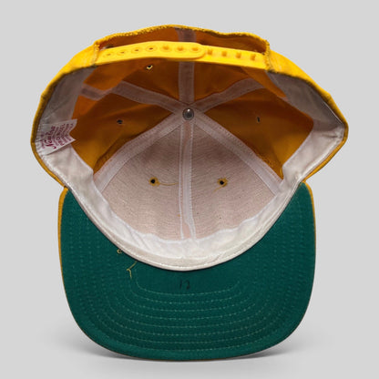 Raree Finds vintage New Era Pro Model snapback hat interior showing gold crown, green visor, and USA made tag.