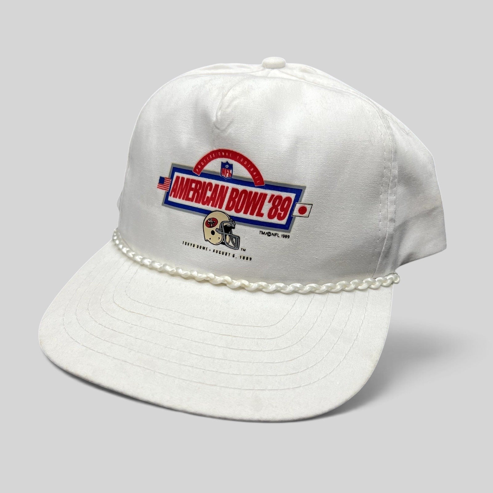 Raree Finds vintage 1989 NFL American Bowl Tokyo Dome white snapback hat with braided rope and 49ers helmet graphic