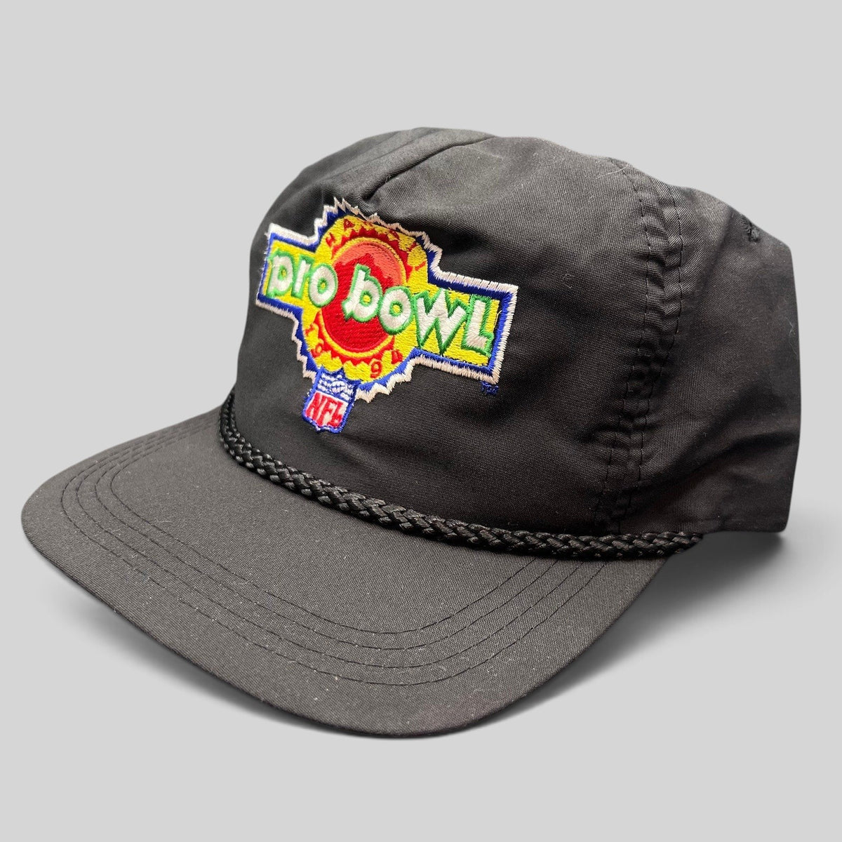 Raree Finds vintage black NFL Pro Bowl snapback rope hat with colorful embroidered logo and braided crown detail.