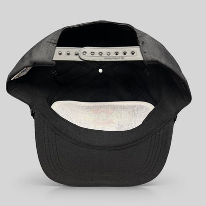 Raree Finds vintage black NFL Pro Bowl snapback hat showing the interior adjustable plastic strap and white mesh lining.