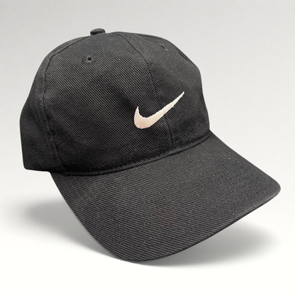 Raree Finds vintage 90s black Nike cotton snapback cap with an embroidered white Swoosh logo on the front panel