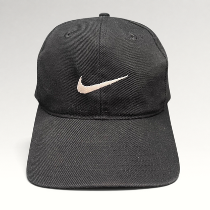 Raree Finds vintage 90s black cotton Nike snapback cap with an embroidered white Swoosh logo on the front panel