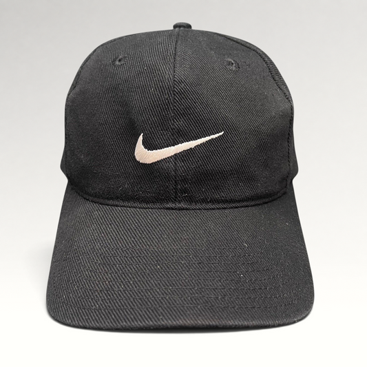 Raree Finds vintage 90s black cotton Nike snapback cap with an embroidered white Swoosh logo on the front panel