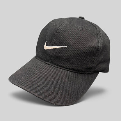 Raree Finds vintage black Nike snapback hat with white embroidered Swoosh logo on the front panel