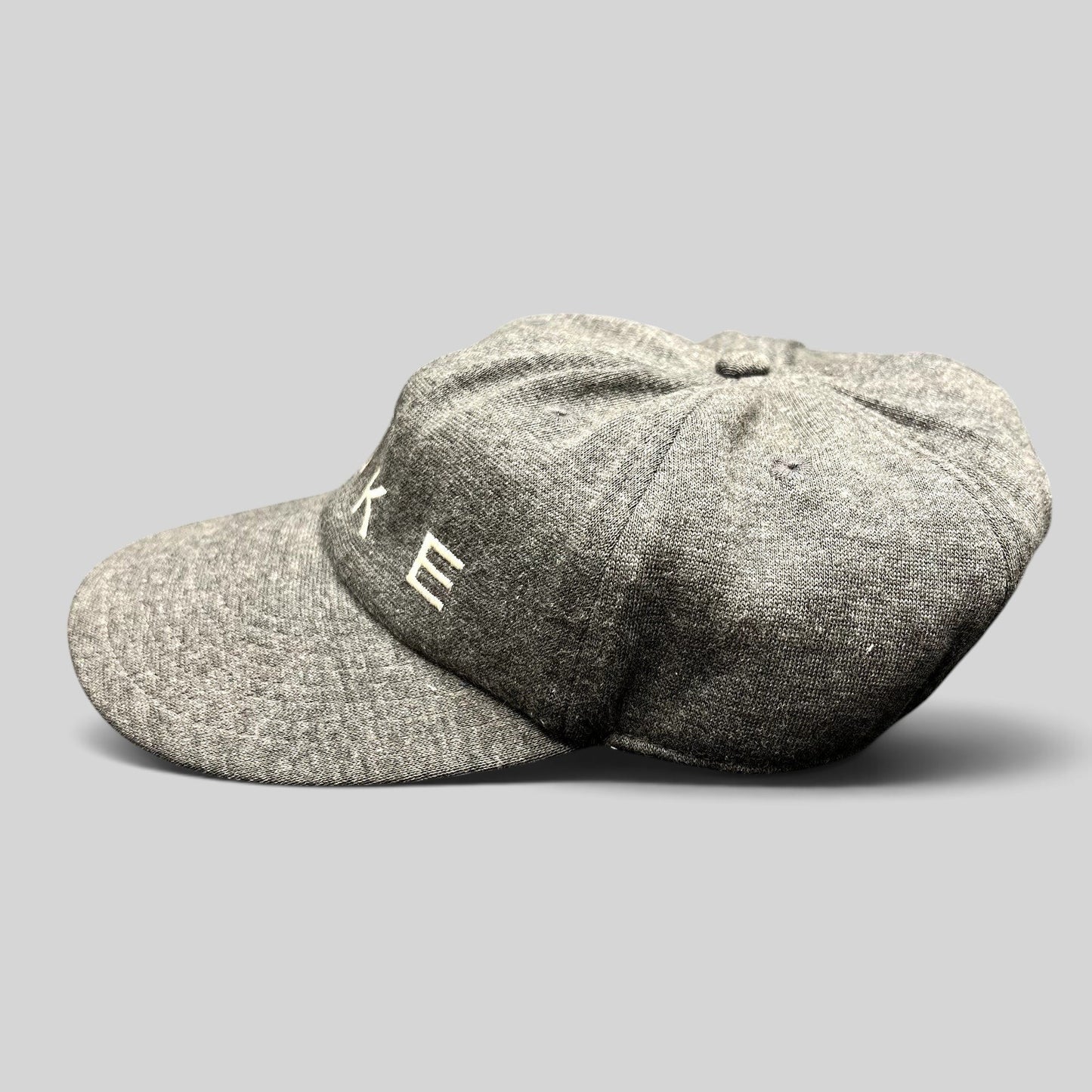 Raree Finds vintage Nike heather gray cotton strapback cap with white embroidered spellout logo and unstructured crown
