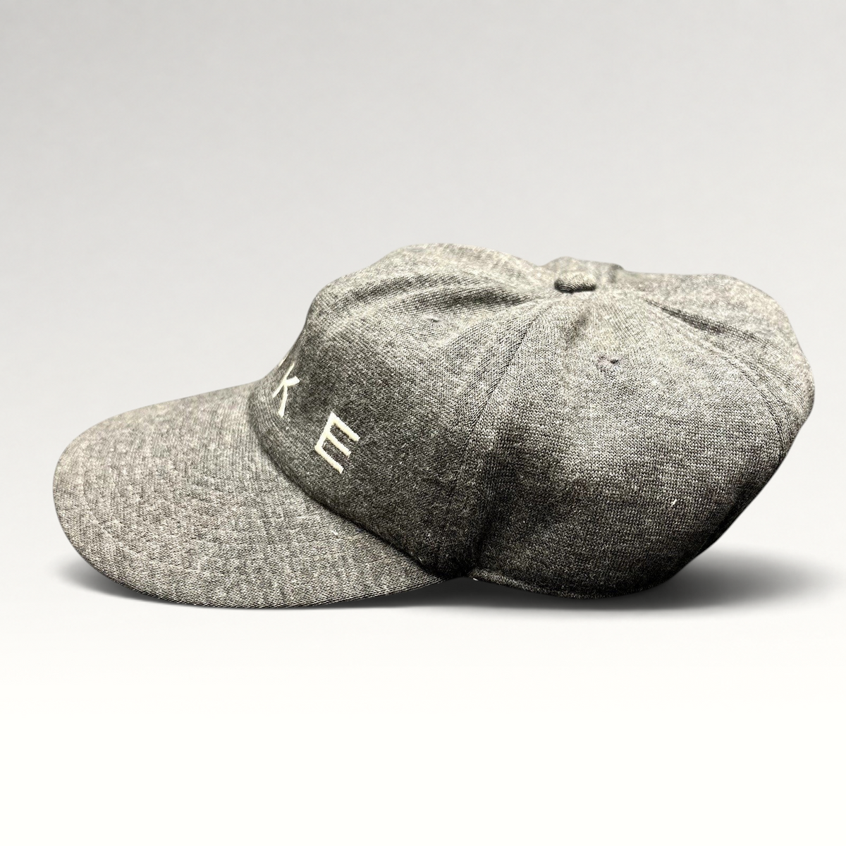 Raree Finds vintage Nike heather gray cotton strapback cap with white embroidered spellout logo and unstructured crown