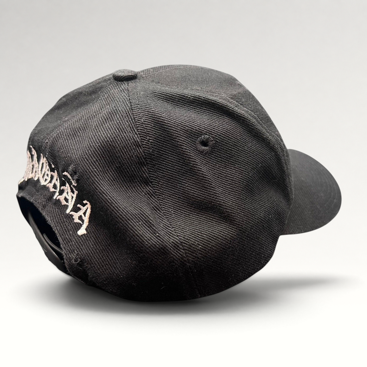 Raree Finds vintage 90s Nike black cotton snapback hat with Magaña script embroidery on the back