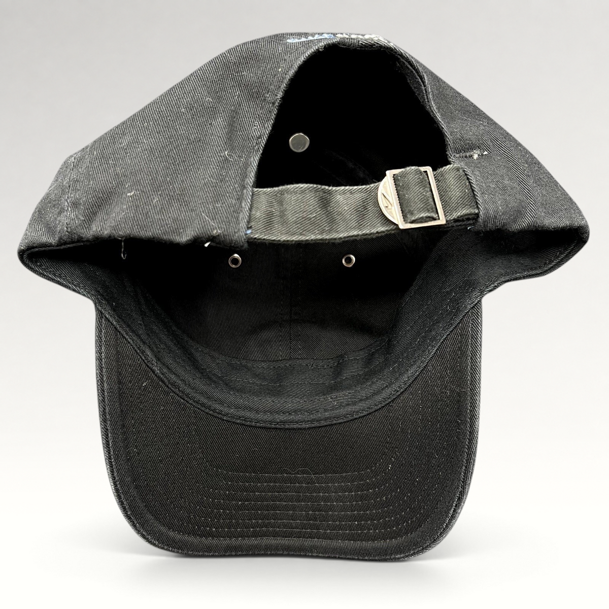 Raree Finds vintage black Nike soccer strapback hat featuring an adjustable metal buckle closure and curved brim.