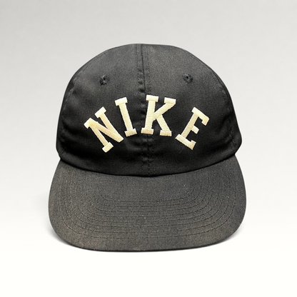 Raree Finds vintage black Nike strapback hat with an oversized arched embroidered spellout logo