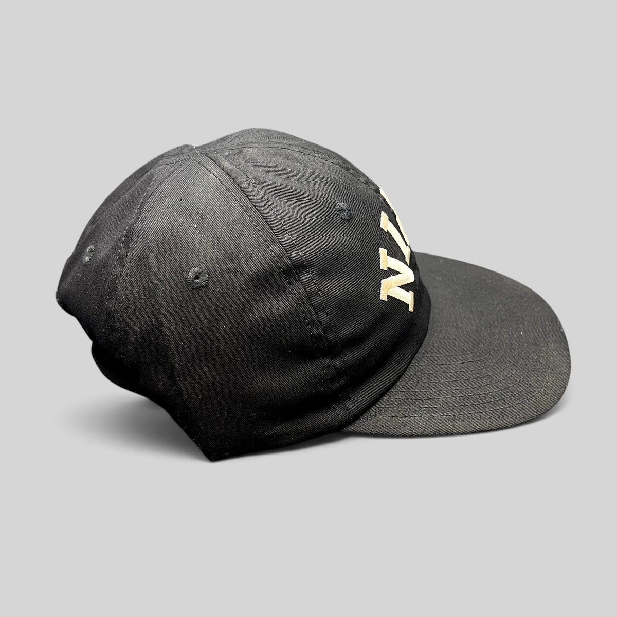 Raree Finds vintage black Nike strapback hat with arched embroidered spellout and green undervisor