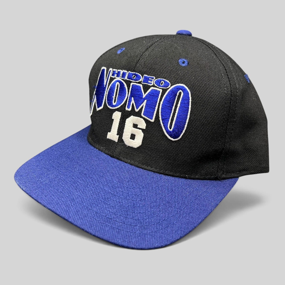 Raree Finds vintage 90s Los Angeles Dodgers Hideo Nomo snapback hat with black crown and blue brim embroidery
