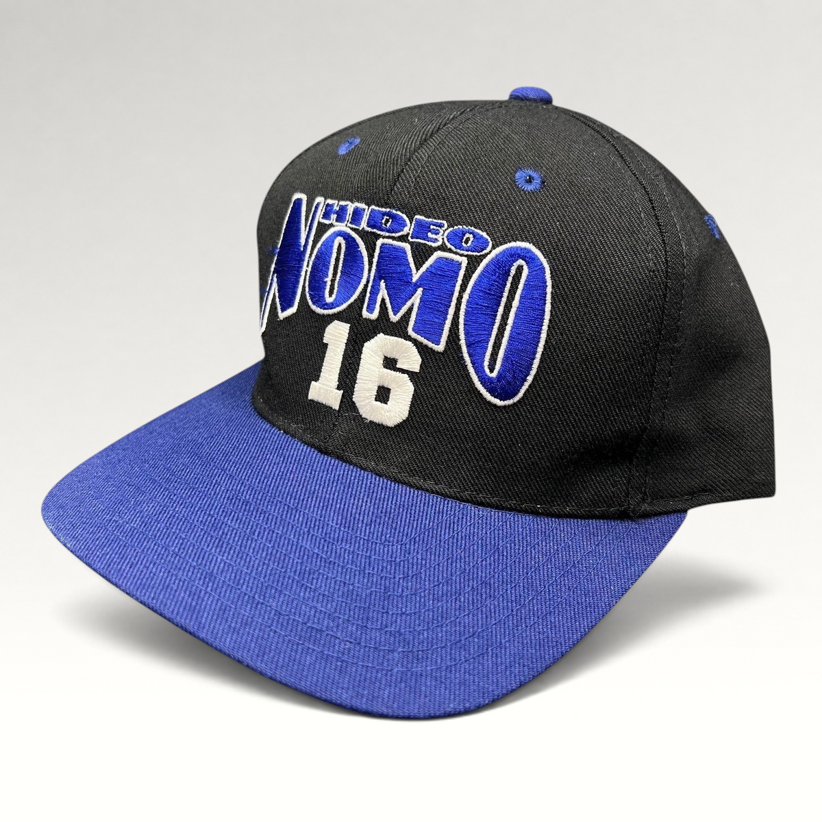 Raree Finds vintage 90s Los Angeles Dodgers Hideo Nomo snapback hat with black crown and blue brim embroidery