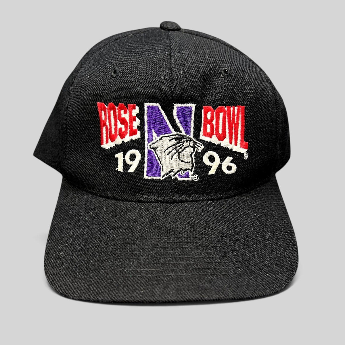 Raree Finds vintage 1996 Rose Bowl Northwestern Wildcats black wool blend snapback hat with embroidered front logo