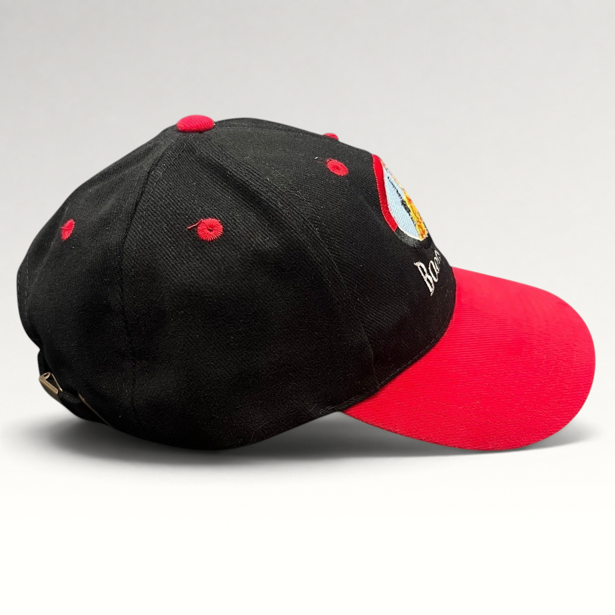 Raree Finds vintage Boots & Coots oilfield firefighter snapback hat with black crown, red brim, and embroidered logo.