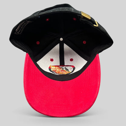 Raree Finds vintage Boots & Coots oilfield snapback hat with black crown, red brim, and embroidered flame logo interior