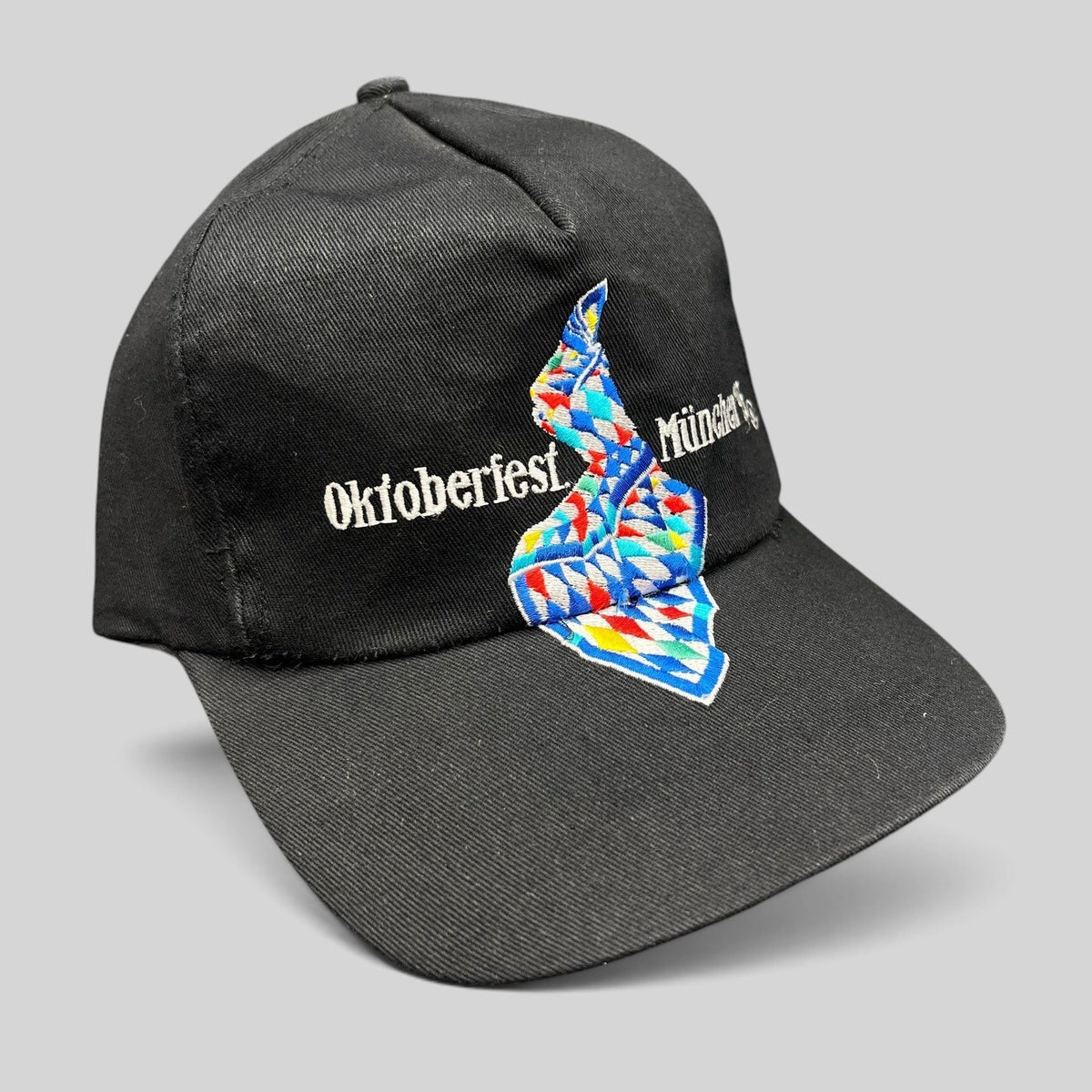 Raree Finds vintage 1993 Oktoberfest Munich black cotton strapback hat with colorful Bavarian geometric embroidery