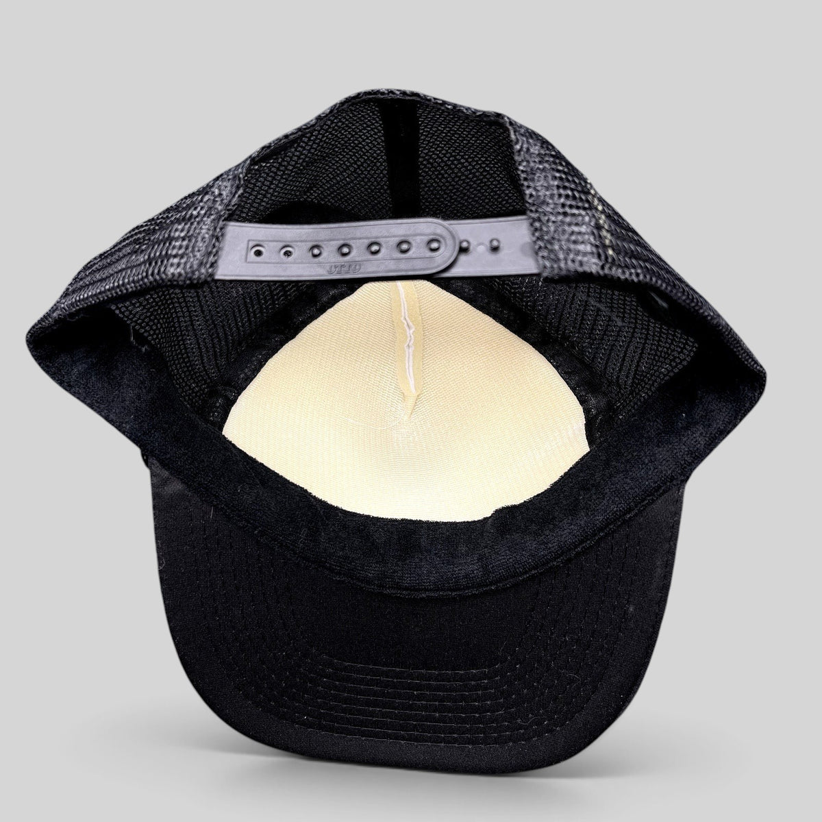 Raree Finds vintage Otto trucker hat interior view showing black mesh back, adjustable snapback, and foam front panel.