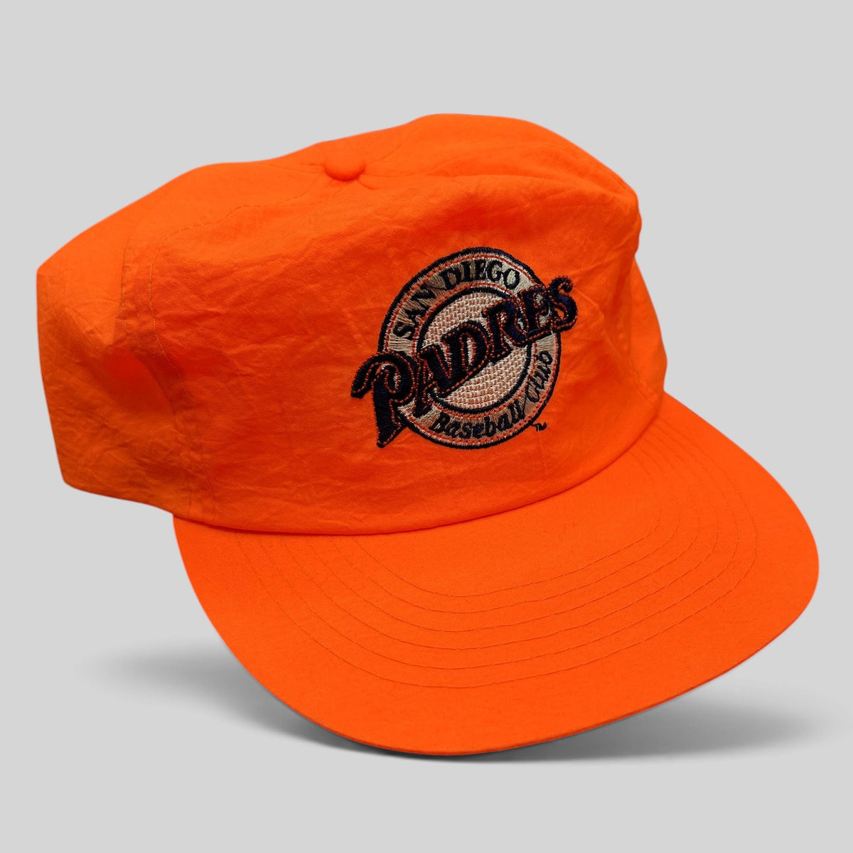 Raree Finds vintage San Diego Padres snapback hat in blaze orange with an embroidered baseball club logo.