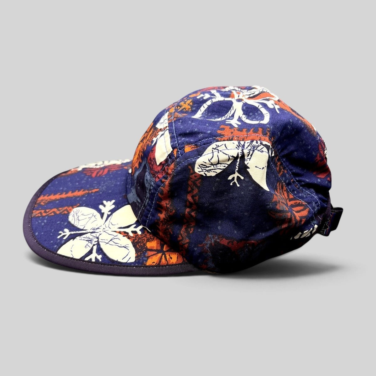 Raree Finds vintage 1996 Patagonia Spoonbill cap in purple tropical print with a soft packable bill and strapback.