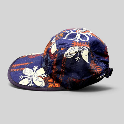 Raree Finds vintage 1996 Patagonia Spoonbill cap in purple tropical print with a soft packable bill and strapback.