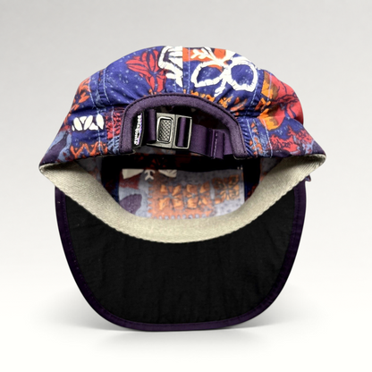 Raree Finds vintage 1996 Patagonia Spoonbill cap with purple tropical print, adjustable strapback, and foldable bill.