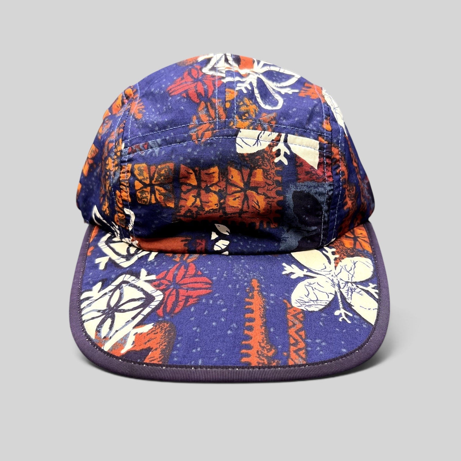 Raree Finds vintage 1996 Patagonia Spoonbill cap in a purple tropical print with a soft packable five-panel design.