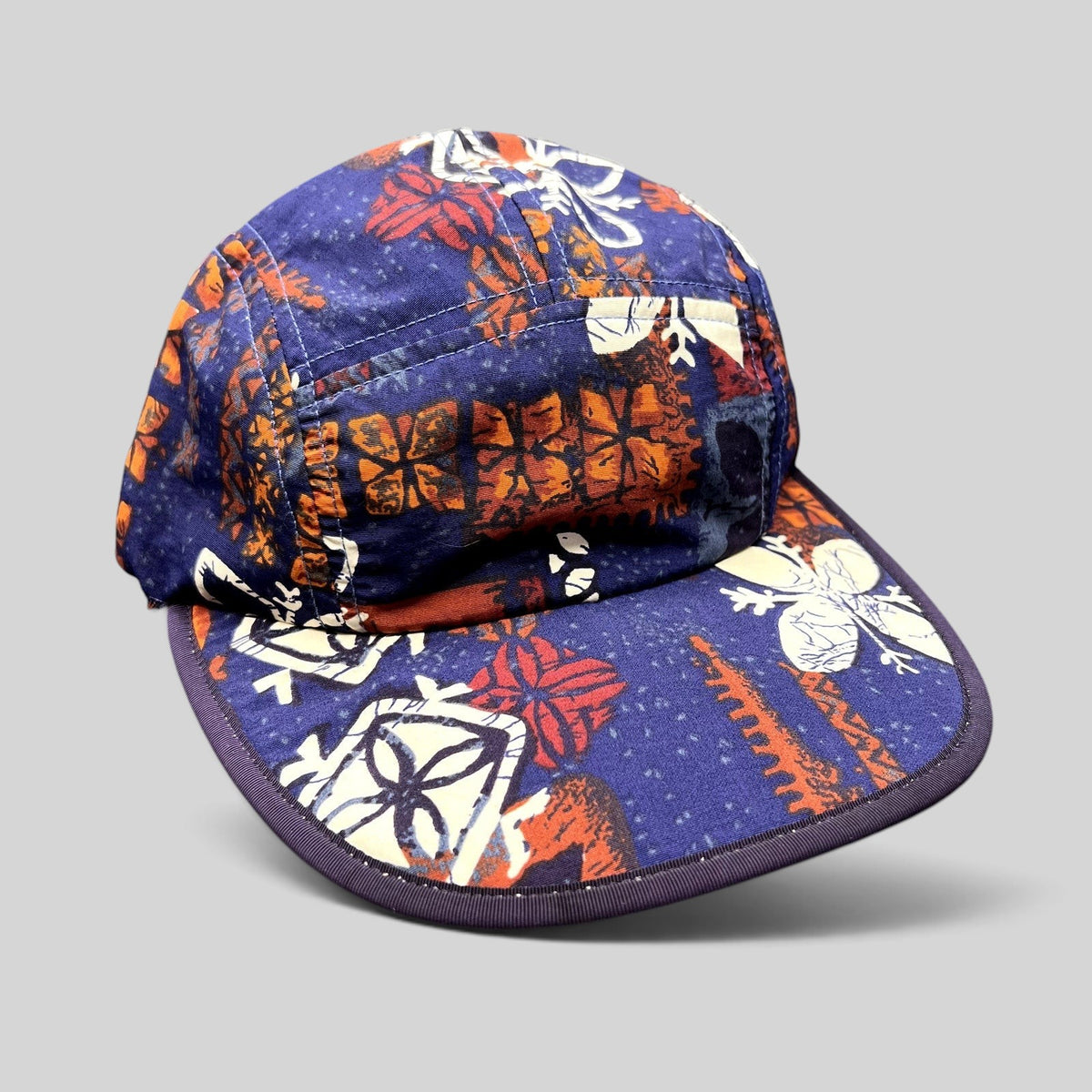 Raree Finds vintage 1996 Patagonia Spoonbill cap in purple tropical print with a soft packable bill and five-panel fit.