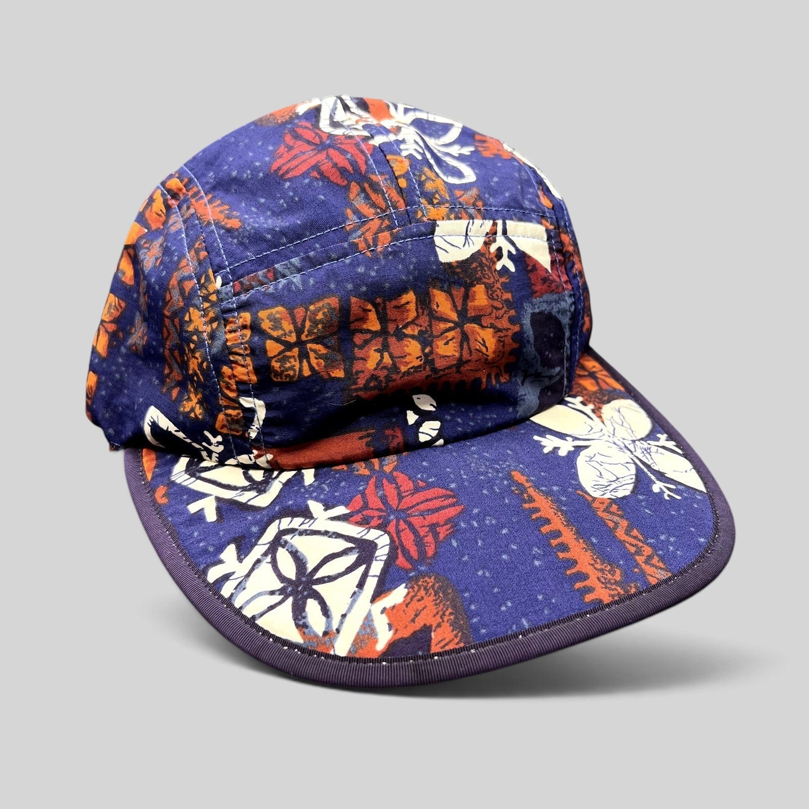 Raree Finds vintage 1996 Patagonia Spoonbill cap in purple tropical print with a soft packable bill and five-panel fit.