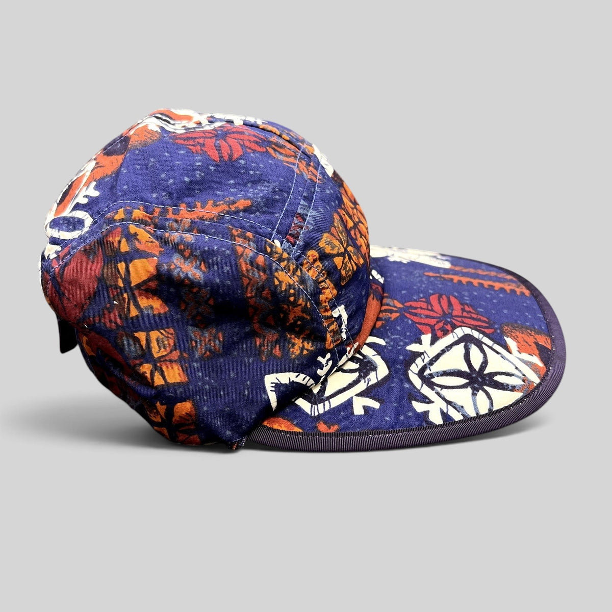Raree Finds vintage 1996 Patagonia Spoonbill cap in purple tropical print with a soft packable bill and strapback.