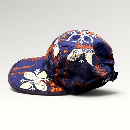 Raree Finds vintage 1996 Patagonia Spoonbill cap in purple tropical print with a soft packable bill and strapback.