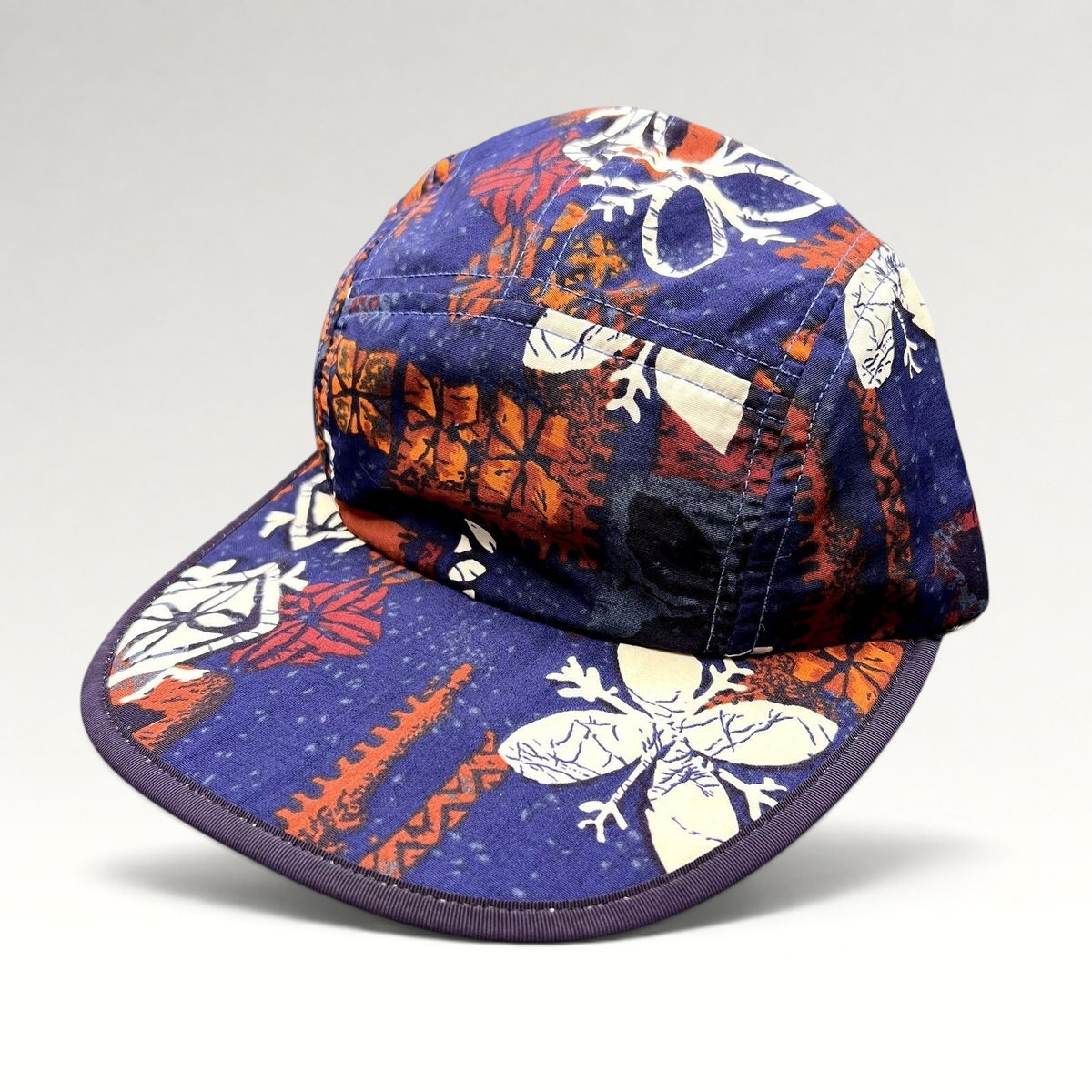 Raree Finds vintage 1996 Patagonia Spoonbill cap in purple tropical print with a soft packable five-panel design.