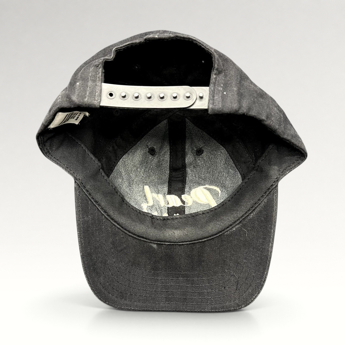 Raree Finds vintage black Pearl Vodka promotional snapback hat with adjustable plastic snap closure and curved brim