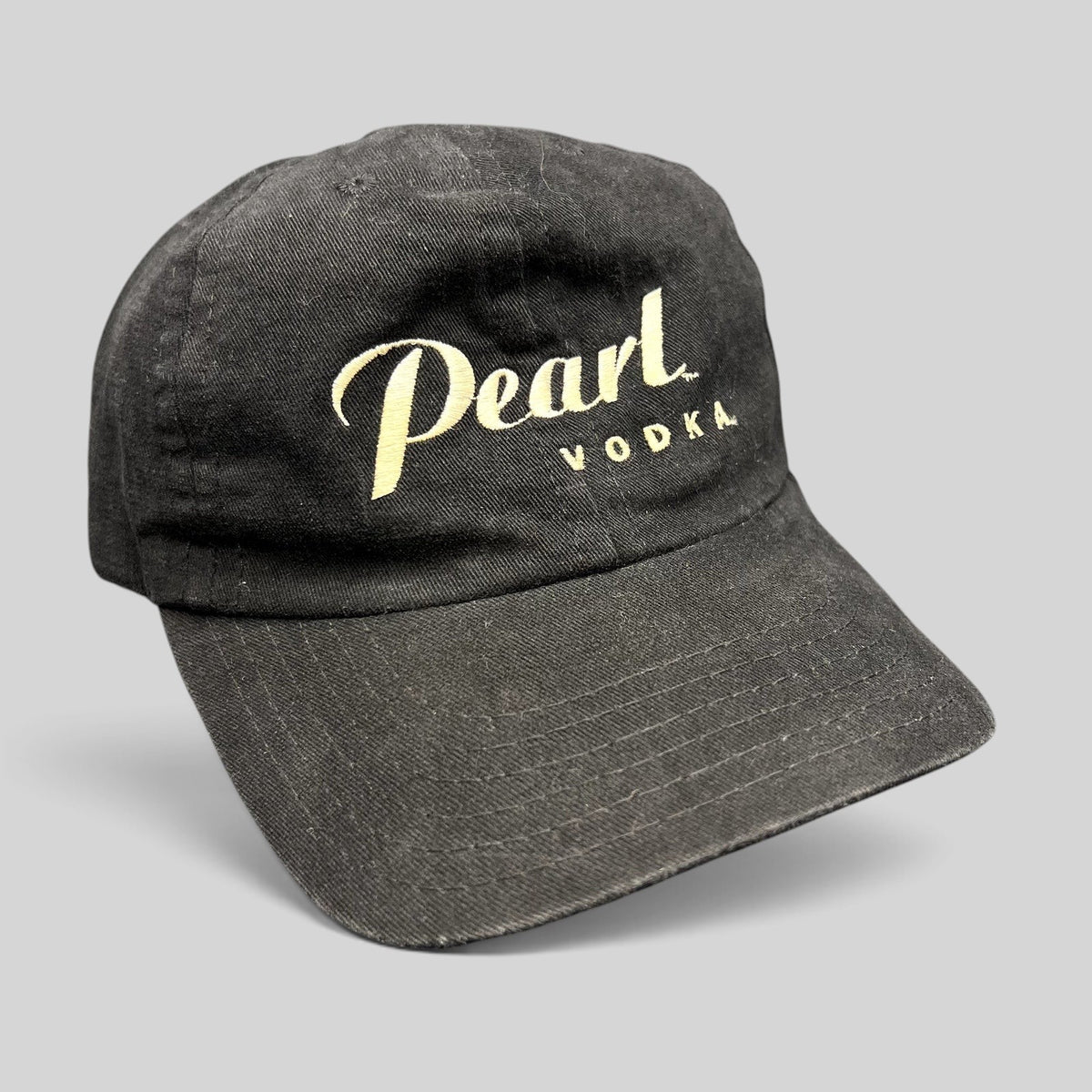 Raree Finds vintage black Pearl Vodka promotional snapback hat with cream embroidered logo and curved brim