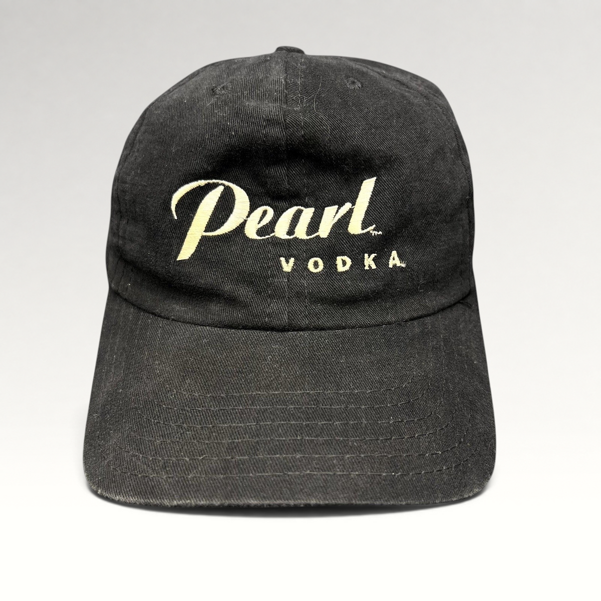Raree Finds vintage black Pearl Vodka promotional snapback hat with cream embroidered logo and curved brim