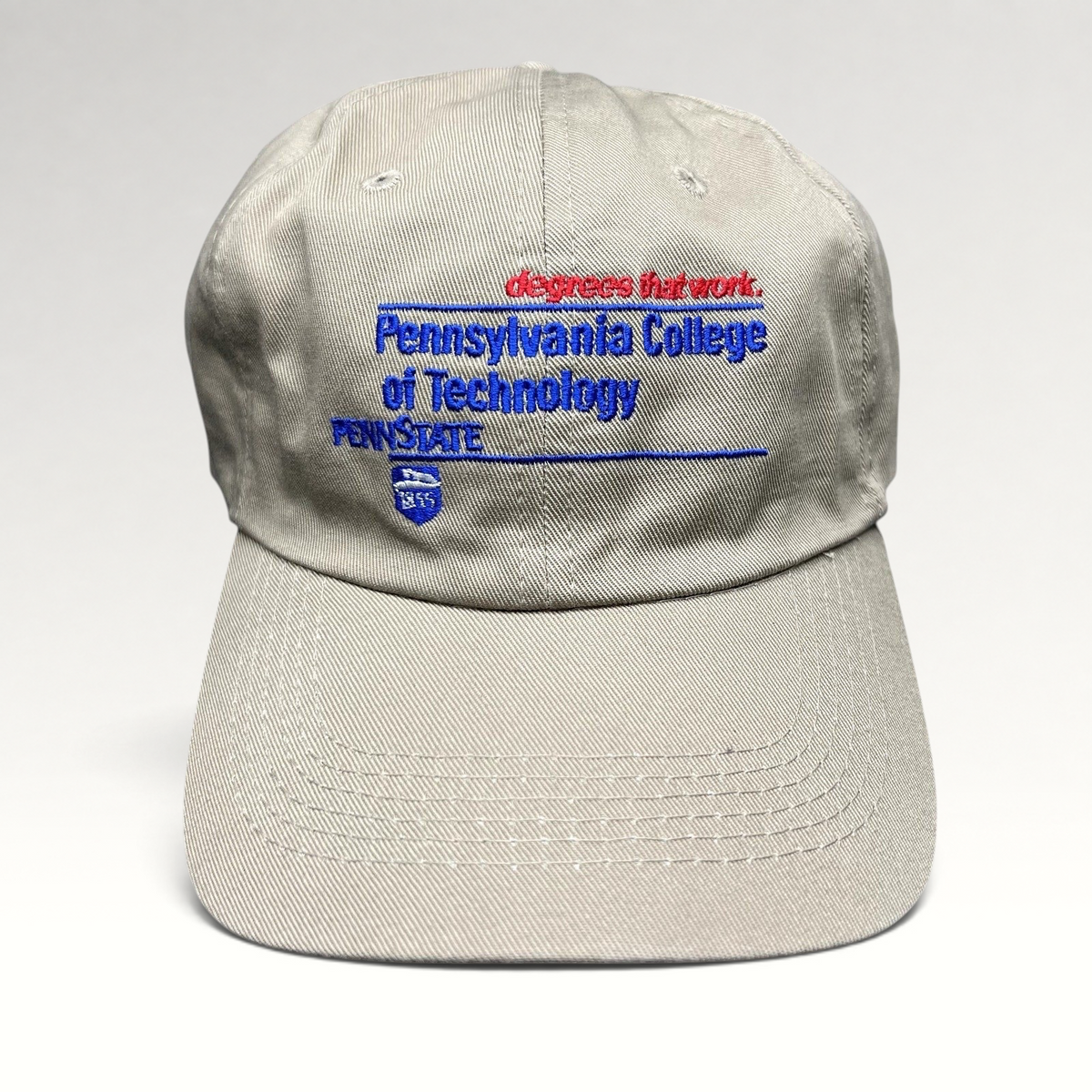 Raree Finds vintage khaki strapback hat with Pennsylvania College of Technology and Penn State embroidered graphics.