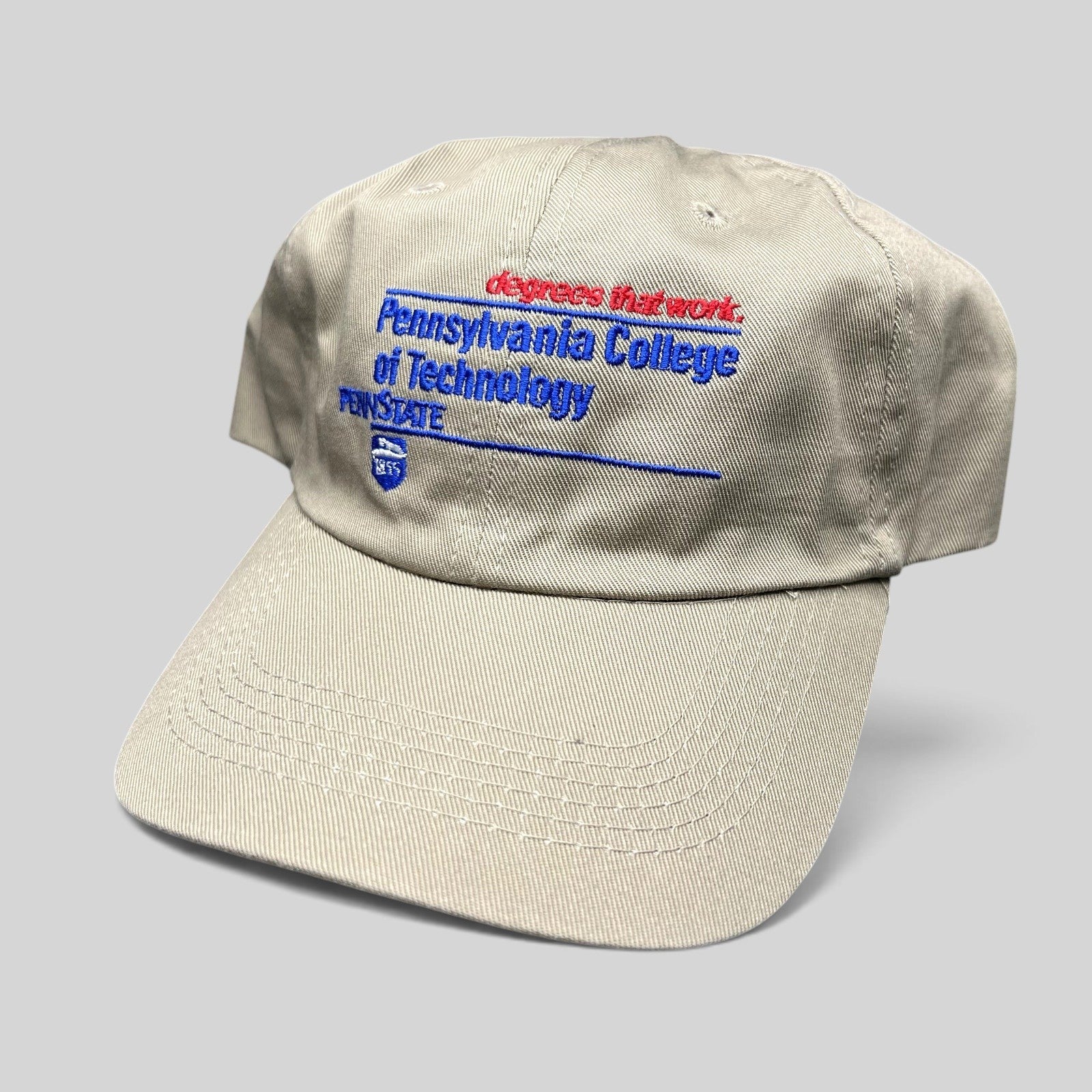Raree Finds vintage khaki strapback hat with embroidered Pennsylvania College of Technology and Penn State graphics.