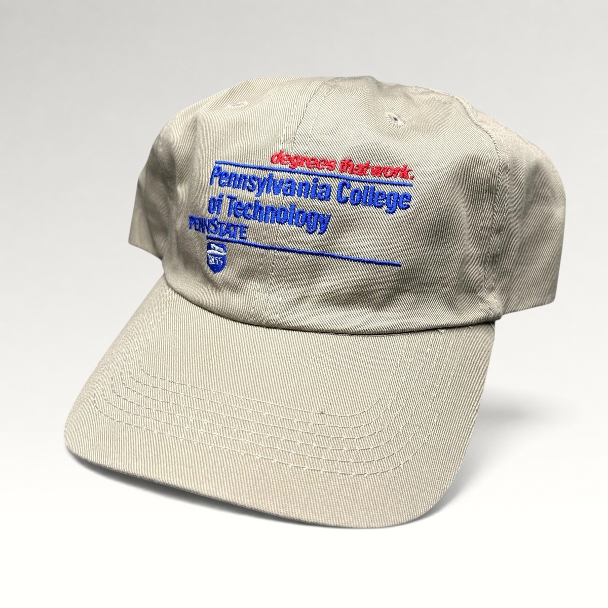 Raree Finds vintage khaki strapback hat with embroidered Pennsylvania College of Technology and Penn State graphics.