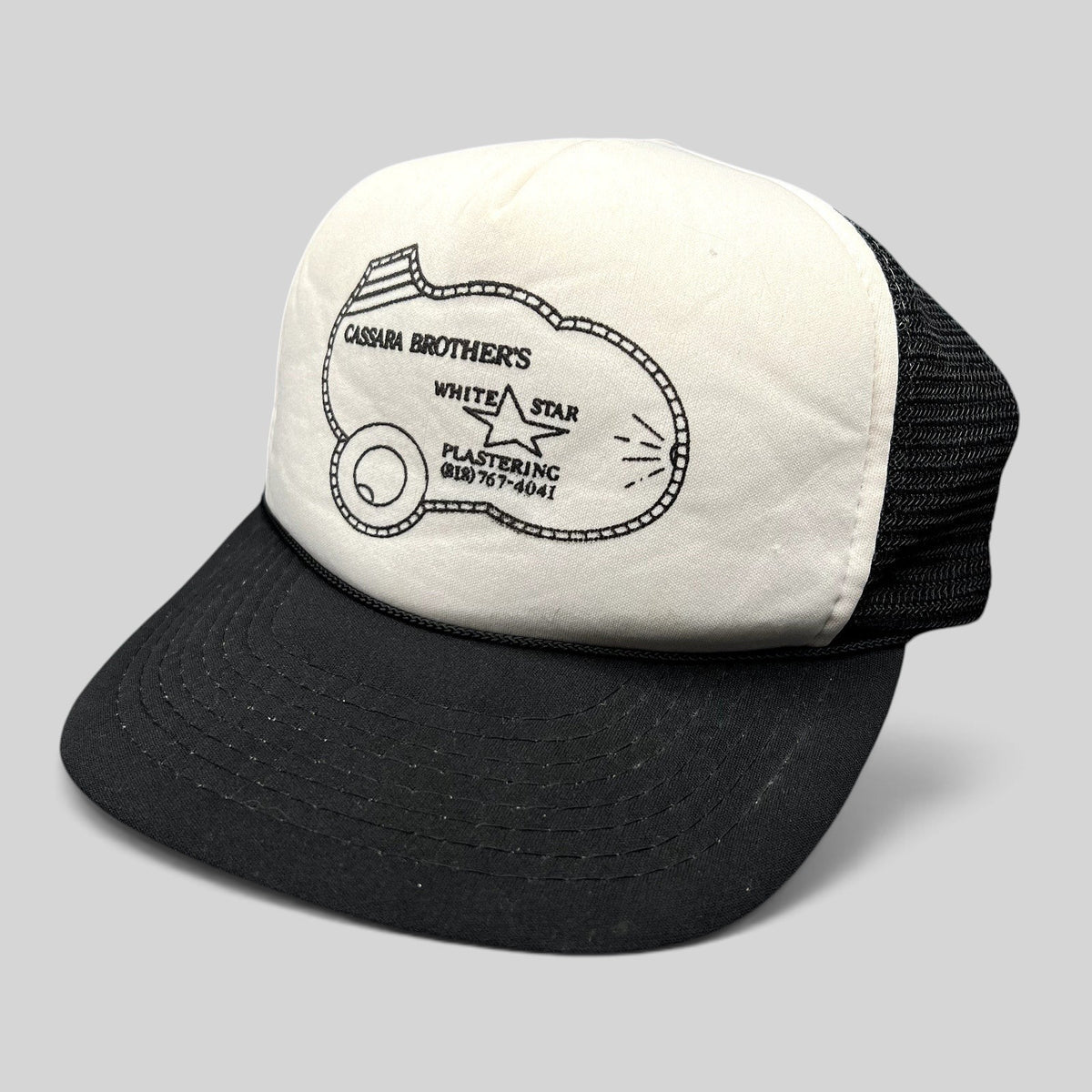 Raree Finds vintage Cassara Brothers White Star Plastering trucker hat with white foam front and black mesh back.