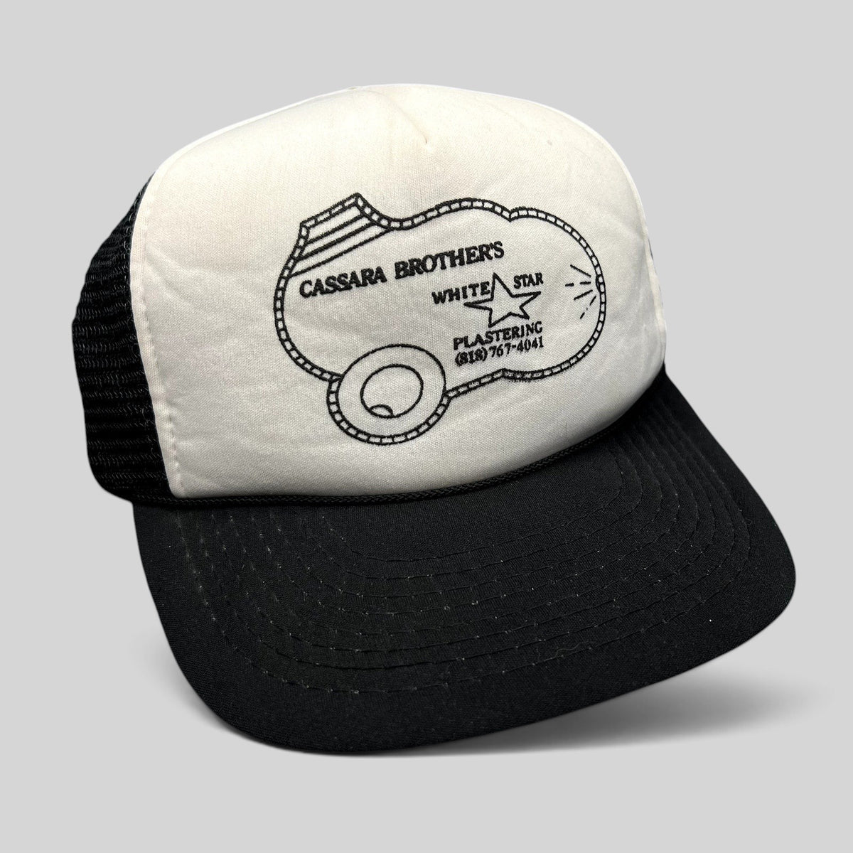 Raree Finds vintage Cassara Brothers White Star Plastering trucker hat with white foam front and black mesh back.