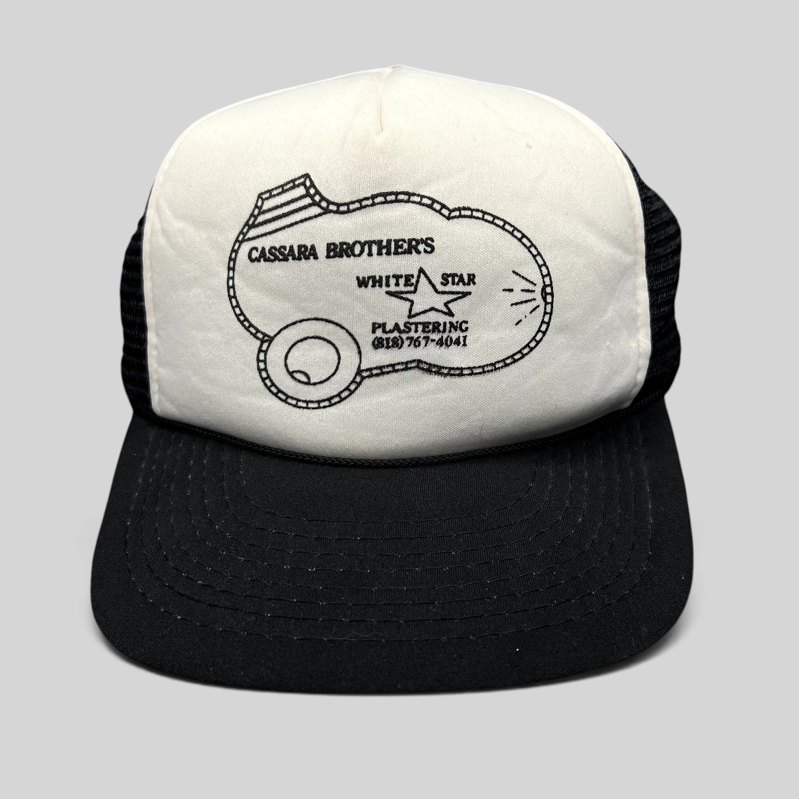 Raree Finds vintage Cassara Brothers White Star Plastering trucker hat with black mesh back and foam front panel.