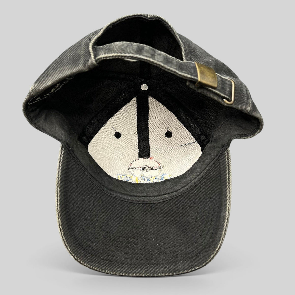 Raree Finds vintage Pokémon strapback hat in faded black cotton twill with metal clasp closure, interior view.