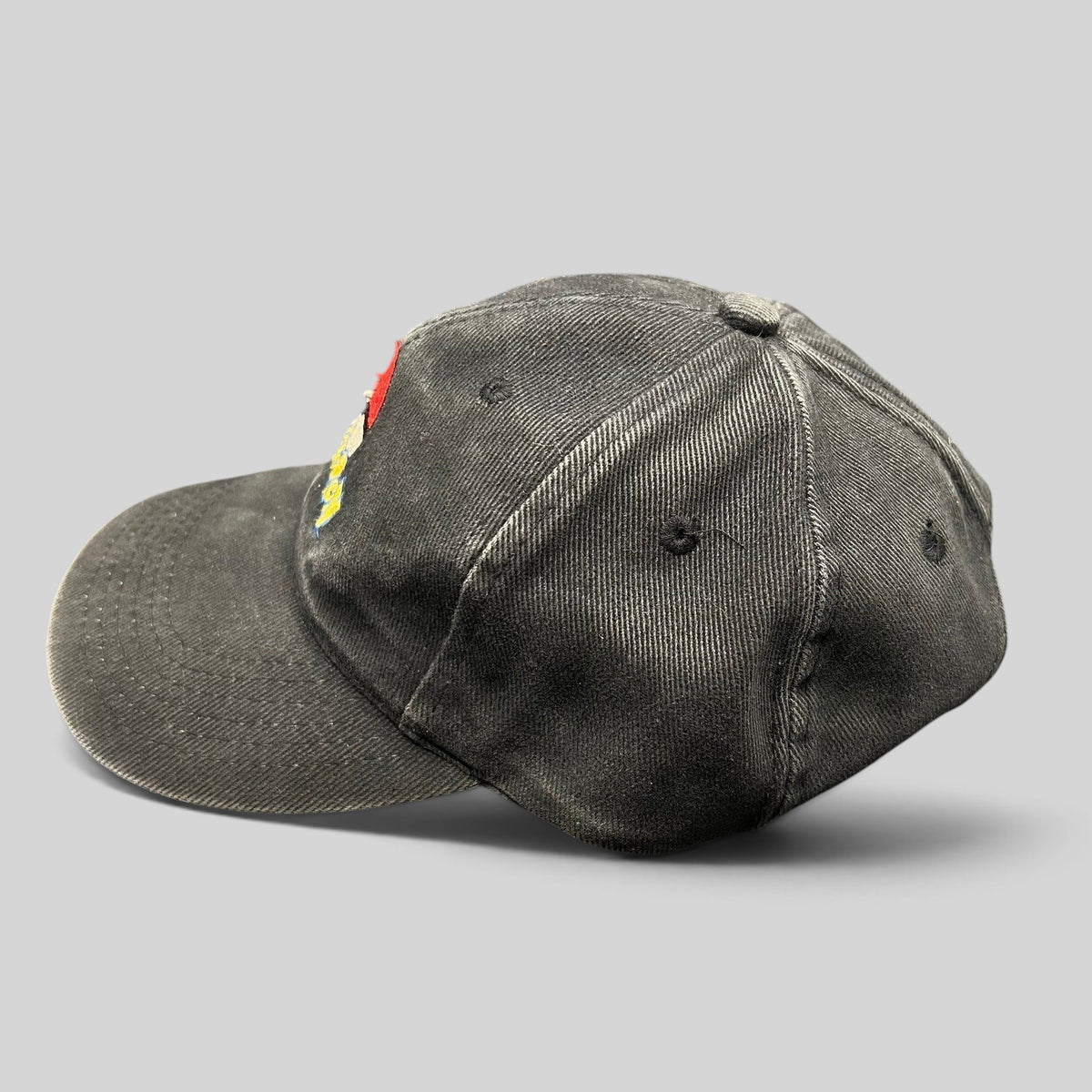 Raree Finds vintage black cotton twill Pokémon strapback hat with Poké Ball logo embroidery and metal clasp closure.