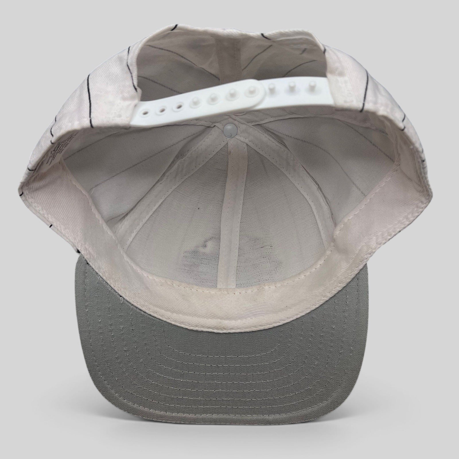 Raree Finds vintage Purdue Boilermakers snapback hat interior view showing white pinstripe crown and adjustable strap